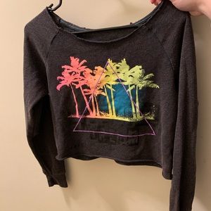 Dark grey cropped shirt.